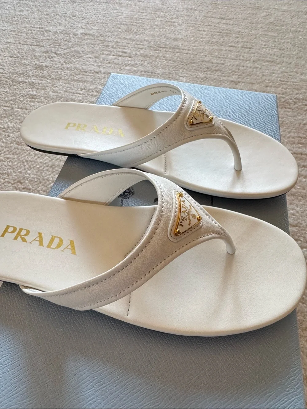 Prada designer white Leather Thong Sandals with Gold Triangle Logo